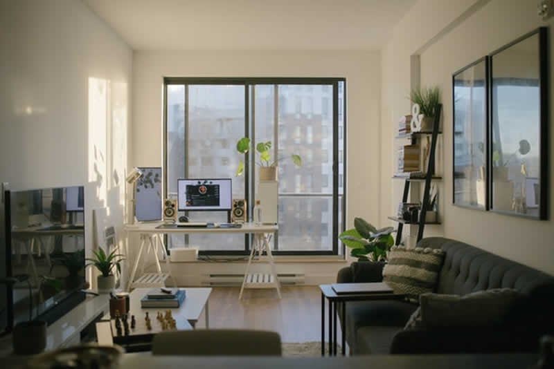 living room with sliding glass door leading to a veranda