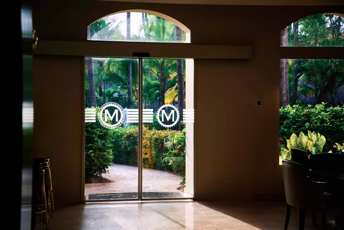 custom sliding glass doors leading to an outdoor garden