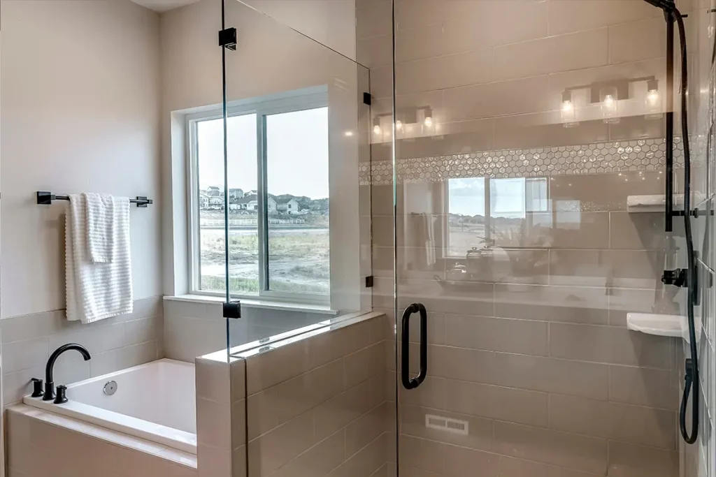 a shower with a frameless shower door