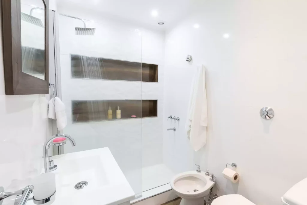 white bathroom with privacy shower glass