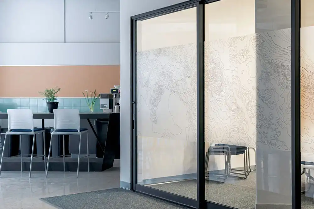 Modern break area beside glass doors.