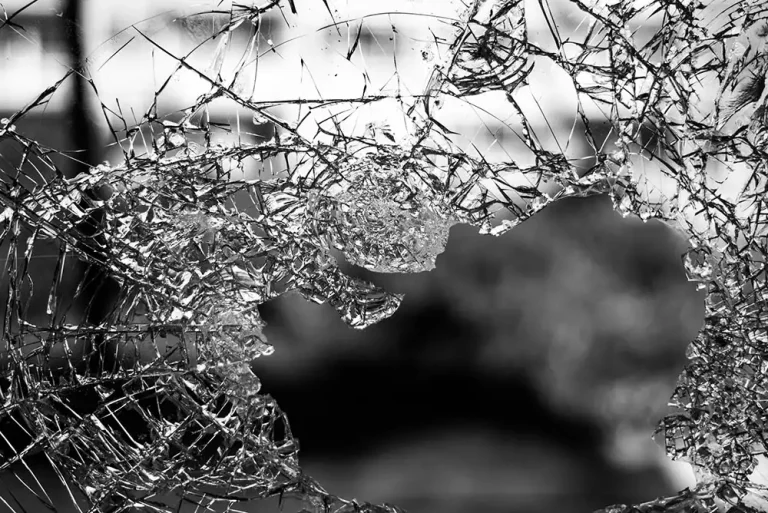A close-up of a broken window.