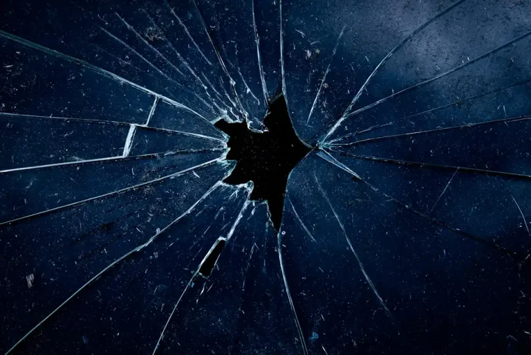 A close-up of cracked and broken glass.